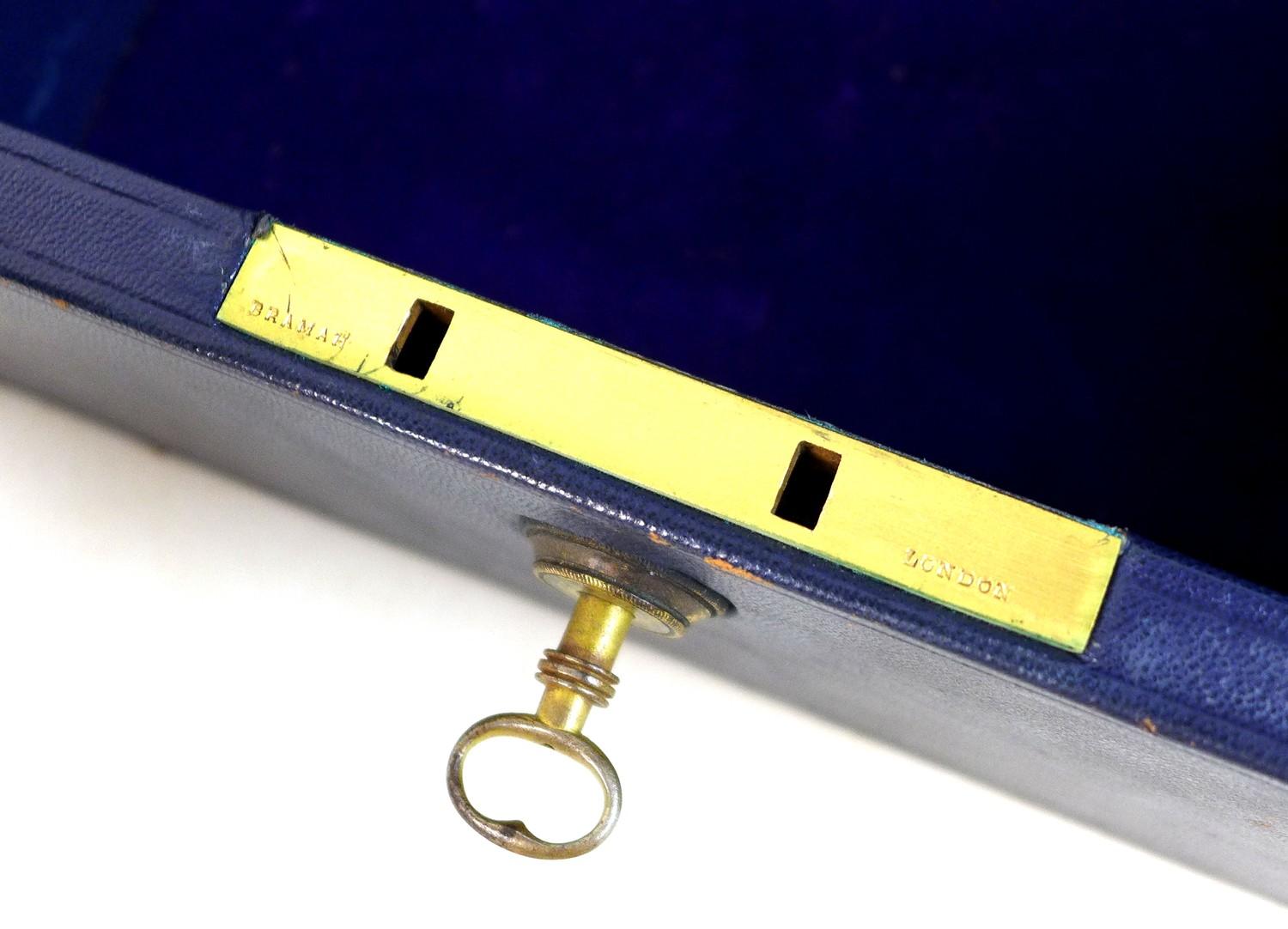 A late Victorian dark blue leather jewellery case, with gilt brass recessed handle with engraved - Image 4 of 11