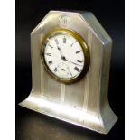 A George V Art Deco silver cased clock, with subsidiary seconds dial, engraved with the initial 'M',