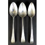 Three George III old English pattern silver table spoons, comprising one with bright cut