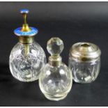 Three silver and cut glass dressing table items, comprising a silver and enamel topped atomiser,