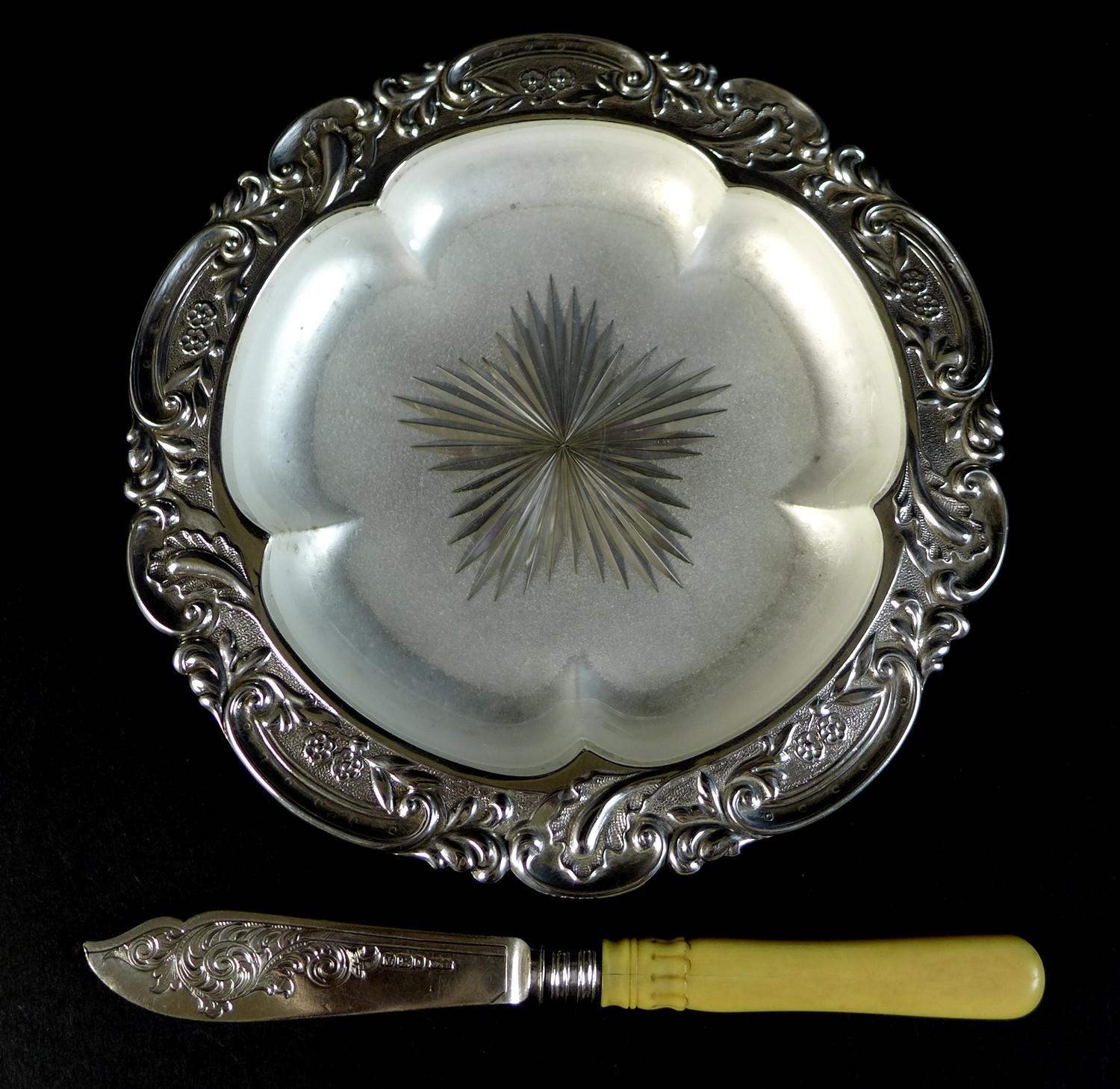 A Victorian silver butter dish, with five lobed bowl, shaped outline with repousse Rococo style