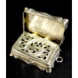 A Victorian silver vinaigrette, of shaped rectangular form, with wave engine turned decoration to