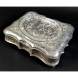 A 19th century Continental white metal jewellery box, with shaped outline, the hinged cover cast