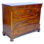 A George III mahogany chest of drawers, crossbanded frieze inlaid with three marquetry roundels over