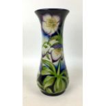 A Moorcroft pottery vase with Festival flowers pattern, of flared form, with impressed marks to