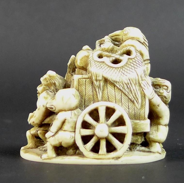 A Meiji period ivory netsuke, formed as a cart being pulled by a demon, with three further - Image 5 of 11