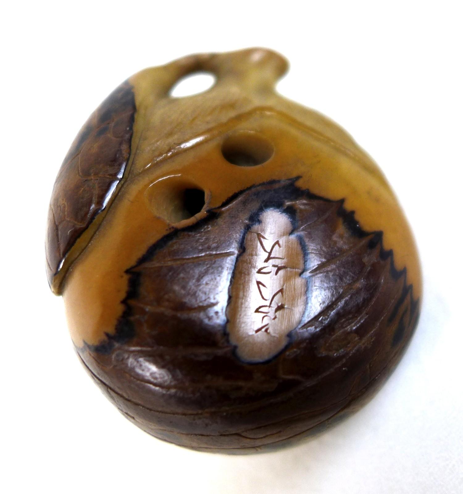 A Japanese Katabori netsuke, likely Meiji period, made out of a tagua nut and shell and carved in - Image 7 of 7