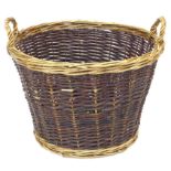 A modern wicker log basket, with twin loop handles, 52 by 43cm high.