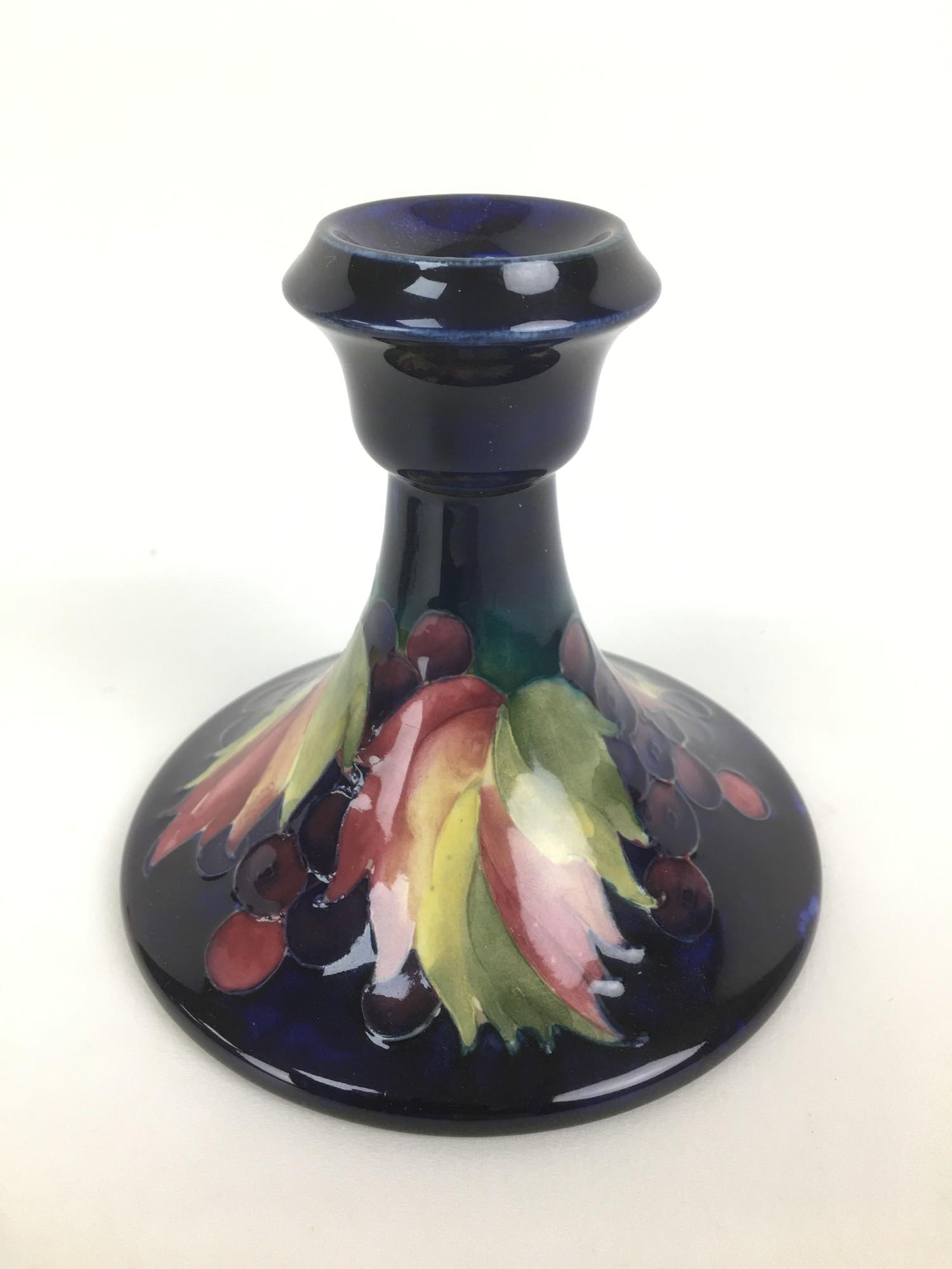 Two Moorcroft pottery candlesticks, comprising one decorated in the leaf and berry pattern, with - Image 2 of 5