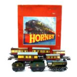 A Hornby O gauge tinplate train set, comprising a 60985 engine, in green livery for British