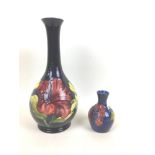 Two pieces of Moorcroft pottery decorated with the hibiscus pattern and with impressed marks to