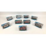 Nine Minichamps 1:43 scale die cast model cars, including a Karmann Ghia Coupe in red, and a BMW