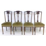 A set of four Art Nouveau mahogany dining chairs, with carved frames and mushroom coloured seats,