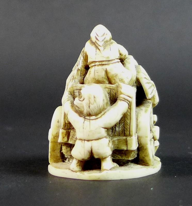 A Meiji period ivory netsuke, formed as a cart being pulled by a demon, with three further - Image 4 of 11