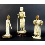 A group of three late 19th /early 20th century ivory okimonos, comprising a figure of an elder, with