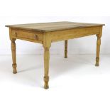 A Victorian pine kitchen table, with single drawer to one end, raised upon turned legs, 89.5 by