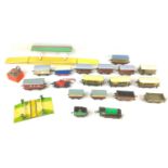 A collection of vintage Hornby O gauge railway models, including a clockwork loco and tender,