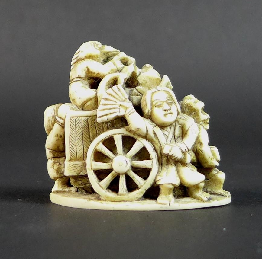 A Meiji period ivory netsuke, formed as a cart being pulled by a demon, with three further - Image 3 of 11