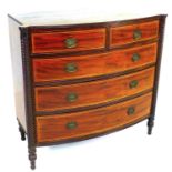 A Georgian mahogany bow fronted chest of two over three drawers, with satinwood and boxwood