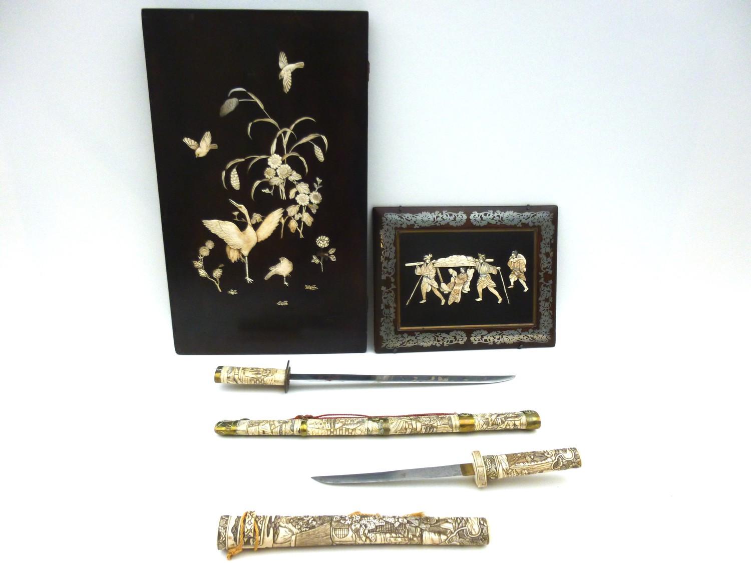 A reproduction Japanese sword or wakizashi in ornately carved bone saya, with matching tsuka, with