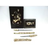 A reproduction Japanese sword or wakizashi in ornately carved bone saya, with matching tsuka, with