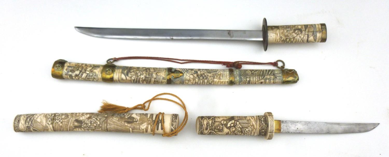 A reproduction Japanese sword or wakizashi in ornately carved bone saya, with matching tsuka, with - Image 2 of 2
