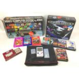 A collection of Nintendo, Atari, Sega games consoles, comprising A Sega Megadrive 16 Bit gaming