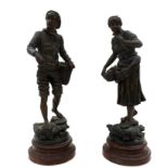 A pair of French bronzed spelter figures, depicting Pecheur au Filet and Pecheuse au Filet, after