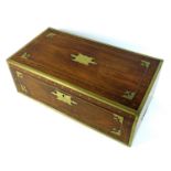 An early 19th century rosewood brass bound writing slope, with campaign handles, secret drawer and