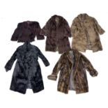 A group of seven vintage fur jackets and coats, including a deep brown soft fur, knee length coat,