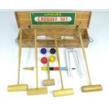 A Jaques croquet set, circa 1990, in pine crate, with four mallets, four plastic balls, centre post,