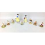 A group of nine Royal Doulton Disney Snow White and the seven Dwarfs figurines, modelled as Snow