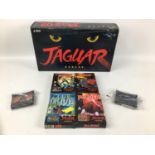 An Atari Jaguar 62 bit games console with original box, controller and six games, comprising Raiden,