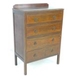 A vintage oak 1950's chest of four drawers with back top rail, 76.5 by 43.5 by 113cm high.