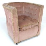 A mid 20th century tub chair, with button back and sides, upholstered in pink velour and buff