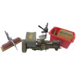 A group of five tools, comprising a GS mitre saw, with burgundy coloured handle, a large double