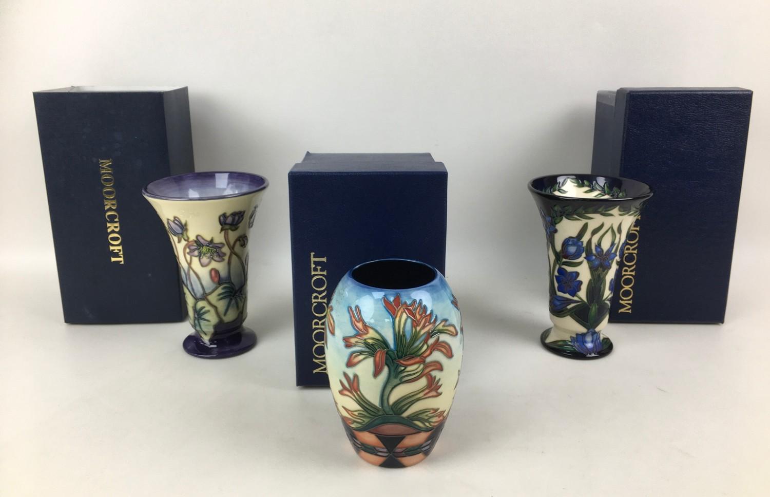 Three Moorcroft pottery vases, comprising two vases of tapering form, one in violet pattern with - Image 2 of 7