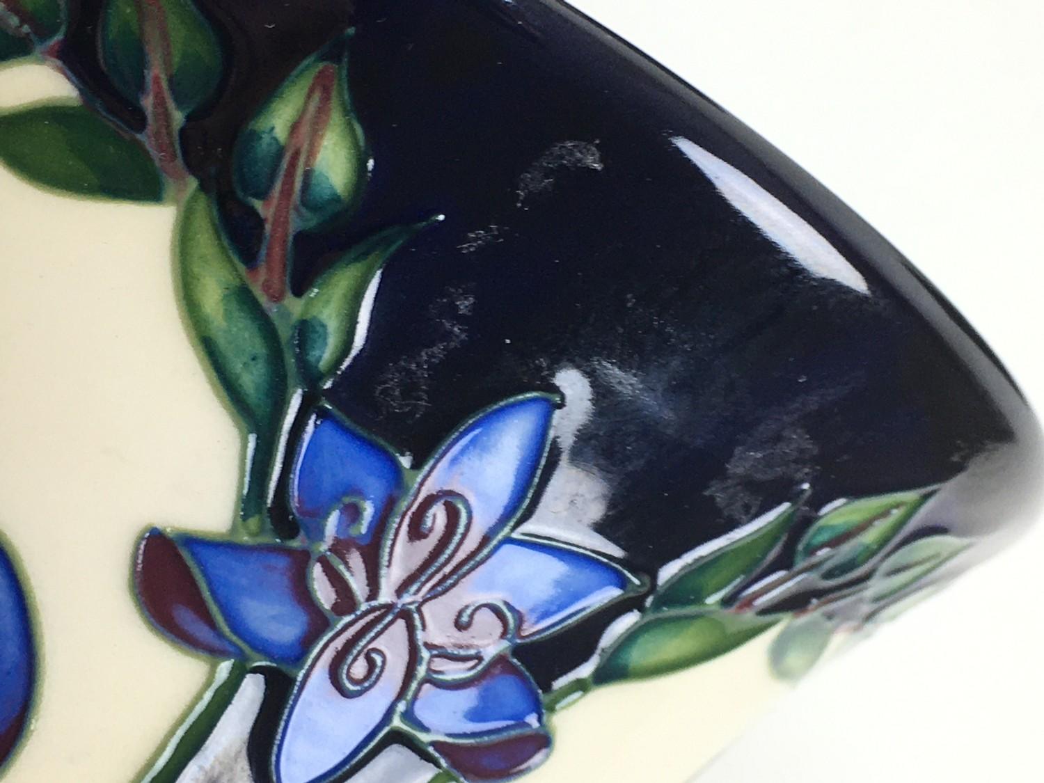 Three Moorcroft pottery vases, comprising two vases of tapering form, one in violet pattern with - Image 6 of 7