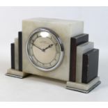 An Art Deco Smith's alabaster mantel clock, retailed by Dossor, Weston-Super-Mare, stepped black and