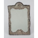 A silver mounted shaped rectangular strut backed mirror,