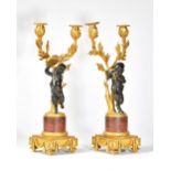 A pair of French ormolu patinated bronze and marble twin light figural candelabra, circa 1860,