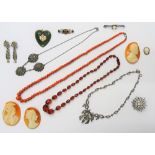 Two silver and marcasite set necklaces, a single row necklace of graduated coral beads,