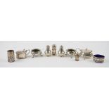 A group of silver condiments, comprising; two mustard pots, a pair of circular salts,