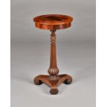 A Regency rosewood jardiniere, the circular top with pop-out centre,