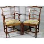 A set of eight George III style mahogany ladder back dining chairs, to include two carvers,