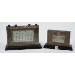 A silver mounted ebonised wooden cased adjustable desk calendar,