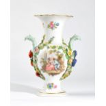A Meissen porcelain two-handled baluster vase, circa 1900, set with leaf moulded handles,