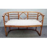 Thonet; a beech bentwood tub back sofa, 123cm wide x75cm high.