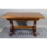 A 20th century Italian stained beech rectangular extending dining table with one integral leaf,