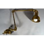 A Vintage style brass wall mounted anglepoise lamp.